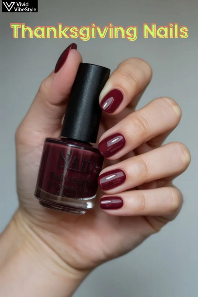 Advanced Thanksgiving nail art featuring 3D pumpkin designs, layered fall leaves, and metallic foil accents on burgundy nails