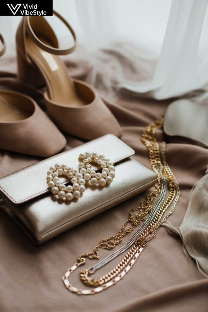 Elegant accessories for plus size wedding guest outfits including pearl earrings, clutch, block heels, and gold necklaces