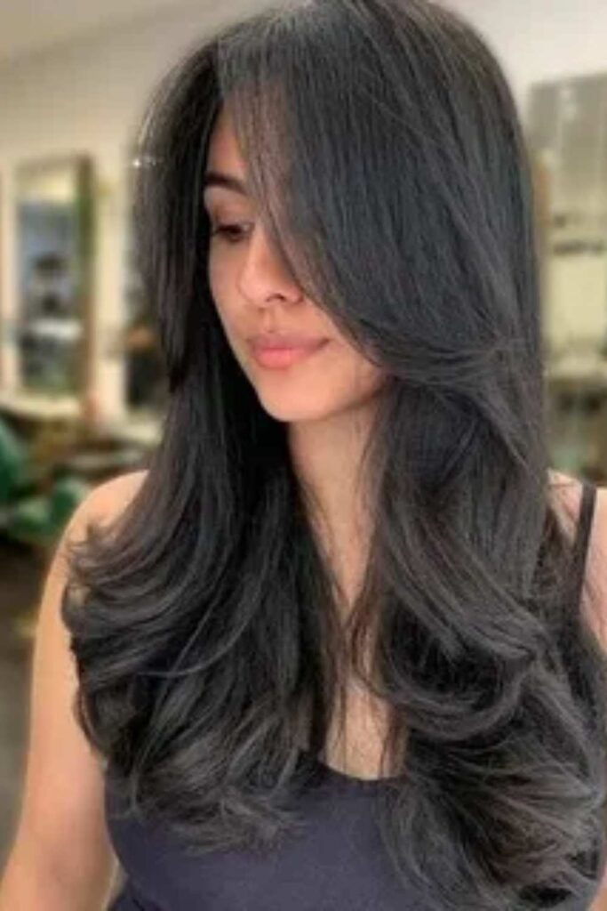 47 Layered Hairstyles for Long Hair That Add Movement, Shape, and Modern Polish (2026) 4 Long layered hairstyles with curtain bangs for balance