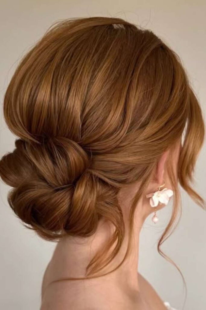 27 Cowgirl Hairstyle Ideas That Feel Modern, Effortless, and 2026-Ready 24 Low chignon with texture