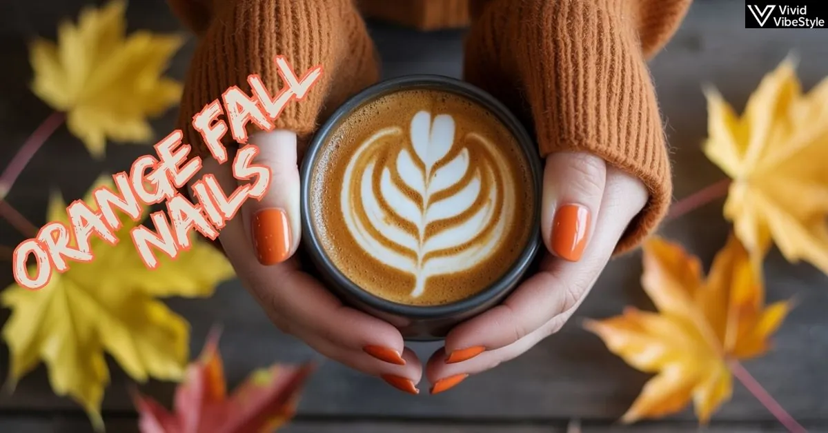 Hands with orange fall nails in different autumn designs holding a latte surrounded by fall leaves trendy nail art inspiration for 2025.